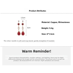 Macro view of geometric water drop earrings with red rhinestones and silver pins