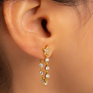 S925 sterling silver gold star stud earrings with diamond tassels on female model