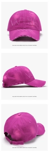 Detailed views of magenta distressed baseball cap with WRA embroidery and worn edges