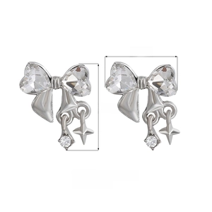 Elegant silver bow earrings with sparkling cubic zirconia and star pendant details