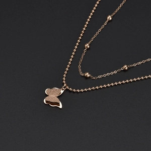 Elegant rose gold double-layered necklace with frosted butterfly pendant and bead chain