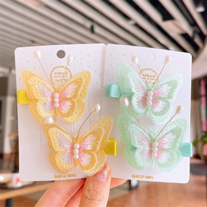 Handmade embroidered butterfly hair clips with faux pearls for girls in yellow and mint green