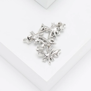 Detailed back view of the vintage butterfly leaf brooch showing the secure pin fastener