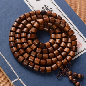8mm sandalwood beads bracelet 108 pieces wrapped on vintage book with zen aesthetic