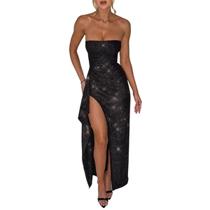 Detail of elegant black sequin fabric and sexy high side slit on the evening dress