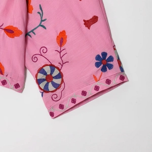 Pink cotton cardigan shirt for women with colorful embroidery details on white background