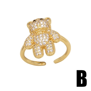 Adjustable golden bear ring with micro-paved white zircons and black stone eyes