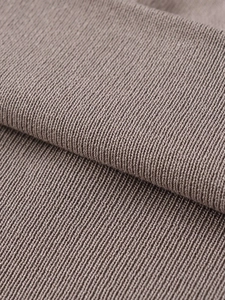 Close-up detail of soft ribbed knit fabric in taupe showing delicate vertical texture