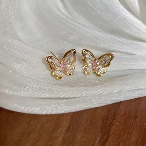 18k gold plated butterfly earrings with pink gemstone and white textured wings
