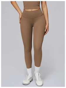 Detailed view of high-waisted seamless mocha yoga leggings with ergonomic shaping fit