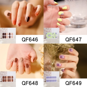 Detail view of four nail sticker styles including cow print and purple hearts patterns