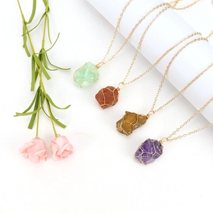 Handmade wire wrapped raw crystal stone necklaces in four colors with gold chains