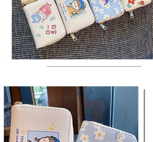 Detail of floral PU leather card holder featuring cute cartoon girls and zipper closure