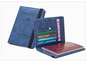 Detail view of the slim navy blue RFID passport wallet with multi-card slots and elastic strap