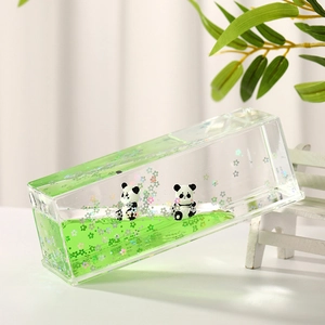 Panda liquid motion bubbler with green oil and floating flower sequins in acrylic frame