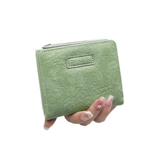 Minimalist light green pleated PU leather short wallet with a stylish gold zipper