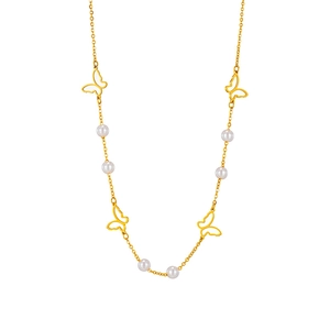 Golden butterfly necklace with white pearls on a clean white background studio shot
