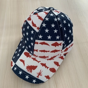 Modern American flag baseball cap with patriotic fish print from a 45-degree angle view