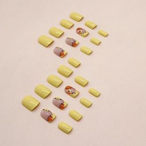 Short square yellow press-on nails with daisy flower and polka dot patterns set of 24