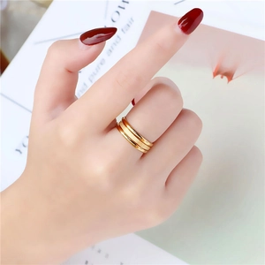 Three-layer stacked gold titanium steel ring set with frosted and polished finishes