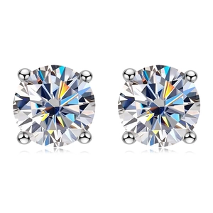 Close-up of four-prong round moissanite earrings in 925 silver with brilliant sparkle