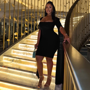Detail of elegant black off-shoulder dress featuring long cape sleeves in a slim fit