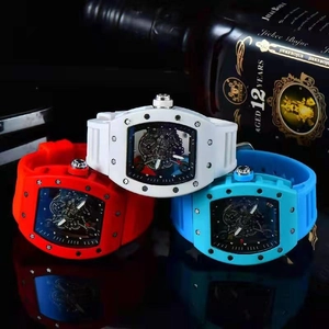 Skeleton luxury wristwatches in red, white, and blue featuring sports rubber straps