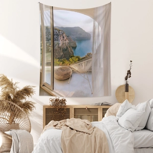 Detail of bohemian tapestry featuring sea balcony print with natural light shadow