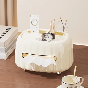 Cream-colored desktop organizer with wave texture and gold feet for tissues and remotes