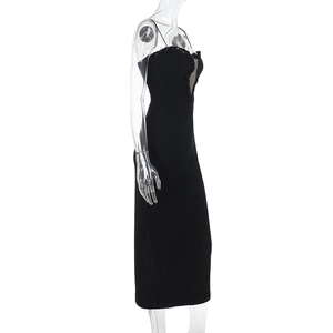 Close-up of black bodycon dress featuring delicate lace embroidery and mesh detailing