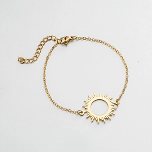 Minimalist golden sunburst pendant bracelet with delicate chain and adjustable clasp