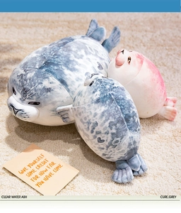 Detailed plush set featuring large grey and small pink seals on a cozy carpet