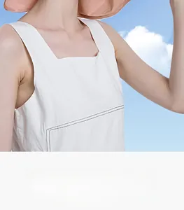 Detail of pink wide brim sun hat and white cotton vest for outdoor summer sun protection