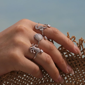 Marine life themed stainless steel ring set with seahorse octopus and shell designs