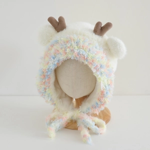 Close-up of soft faux mink fur reindeer hat for kids with colorful plush details