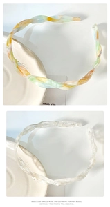 Detailed view of woven acetate headbands with colorful marble and cloud textures
