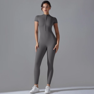 Close-up of the front zipper and stand-up collar detail on dark grey yoga catsuit