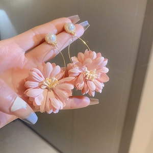 Elegant pink fabric flower drop earrings with a round white pearl and golden accents