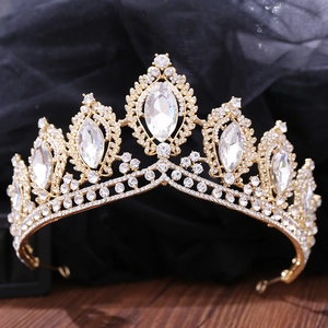 Detail shot of golden baroque bridal crown with sparkling rhinestones and crystal accents