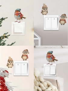 Détail d'autocollants muraux d'oiseaux et hiboux de Noël mignons sur interrupteurs