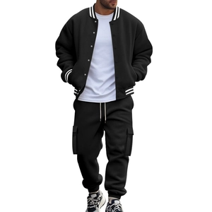 Detailed view of men's black baseball jacket with white tee and cargo pants set