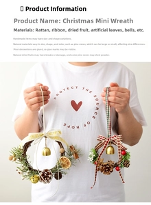 Detail of handmade Christmas wreaths with pine cones red berries and bells