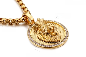 Detailed close-up of 18K gold plated lion head pendant with diamonds and heavy chain