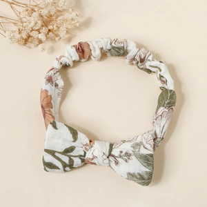 Close-up of floral print cotton baby headband with a soft bow and vintage flower pattern