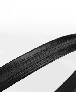 Macro detail of men's leather belt featuring durable rubber track and double stitched edges