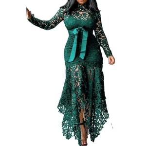 Detail of green lace maxi dress showing long sleeves and silk-textured waist belt