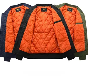 Detail of MA1 flight jacket interior with orange quilted lining in multiple colors
