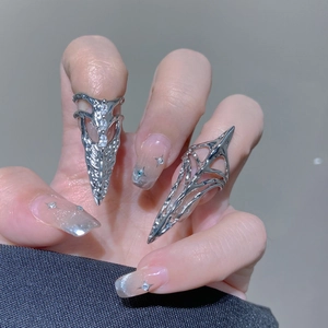 Detailed view of silver gothic armor rings with hollow design and rhinestone accents