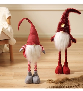 Detail of plush Christmas gnomes with retractable long legs and knit striped hats décor