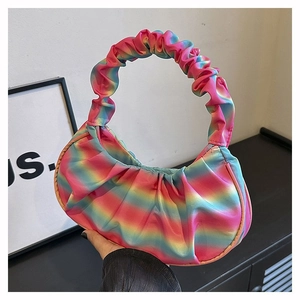 Detailed texture of rainbow gradient pleated handbag with silky satin finish